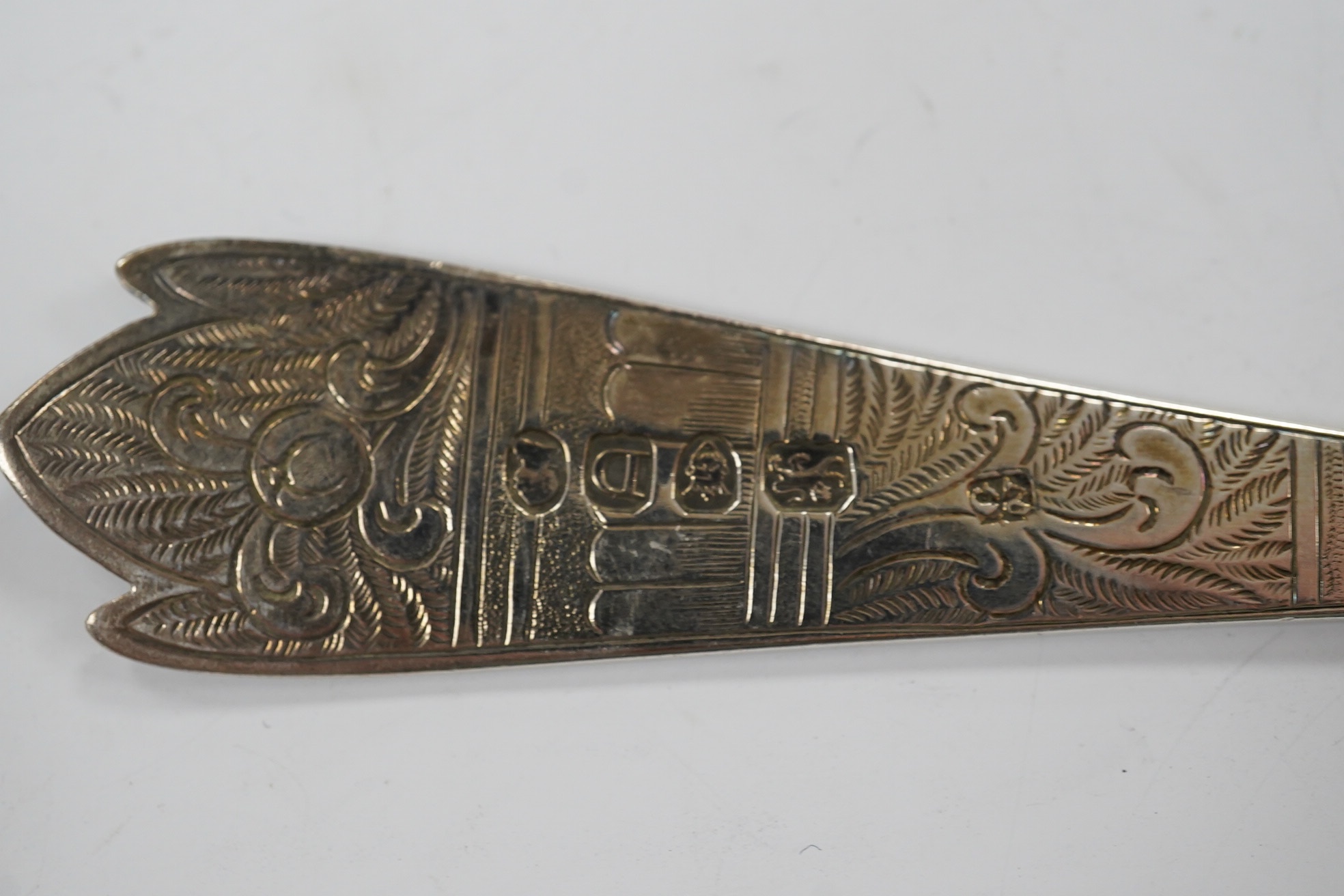 Five assorted George III and later serving spoons with later engraved decoration, earliest London, 1791, 16.8cm, 6.4oz. Condition - fair
